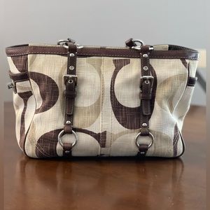 Beautiful Coach Purse.  Tan, brown and cream in color with buckle accents.